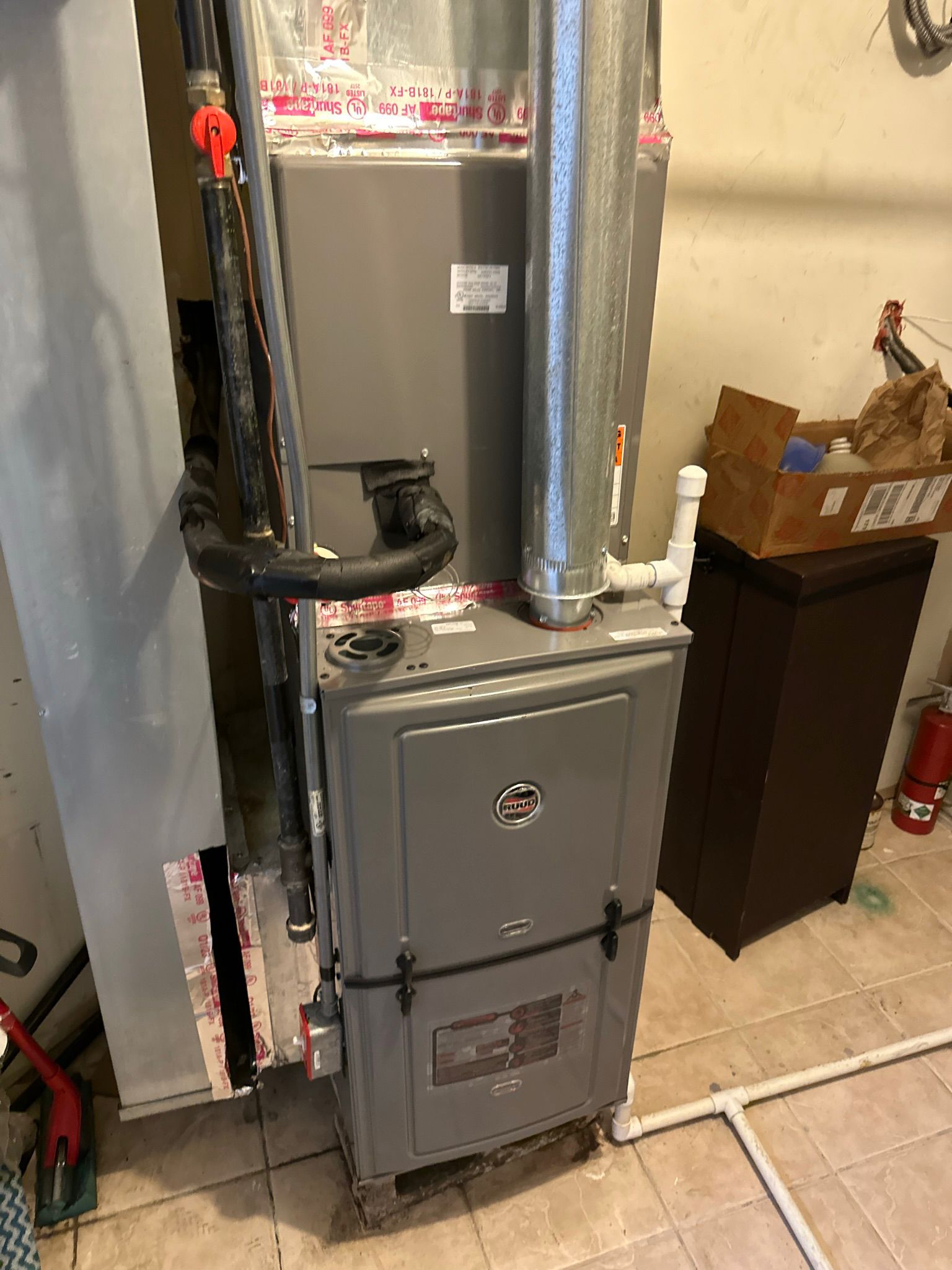 Leaking water heater being repaired – Woodland Park NJ