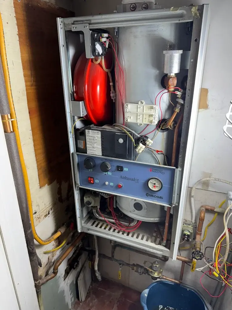 Heating Services repairing a gas furnace in Woodland Park NJ home