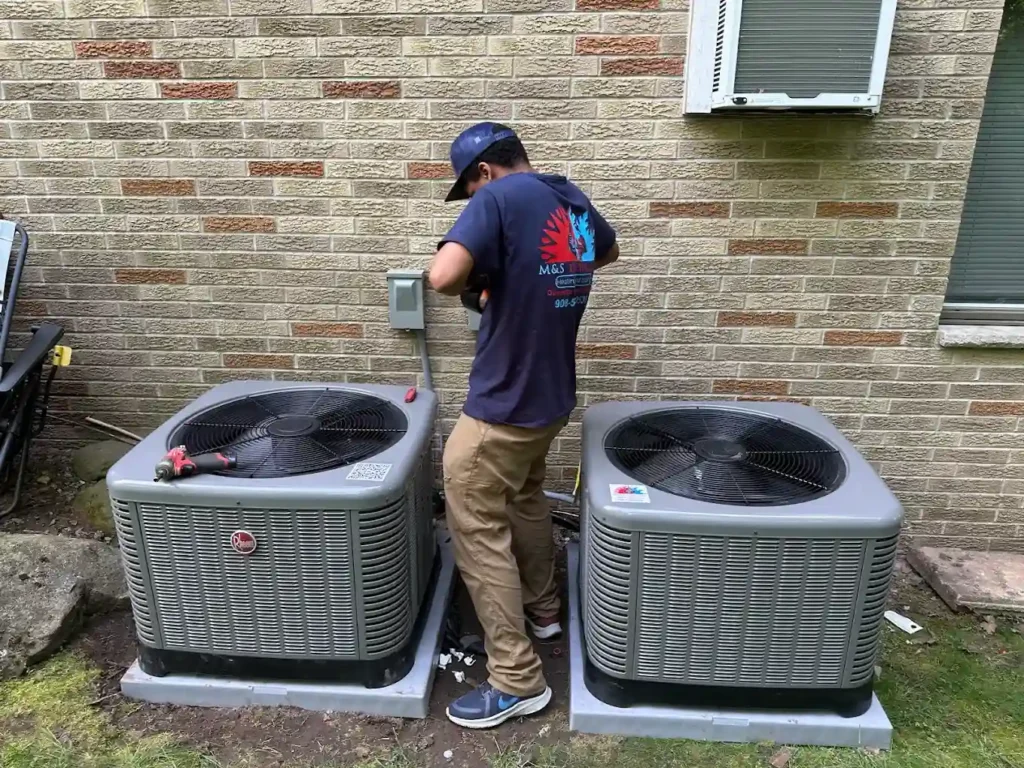 ac repair team installing ac in woodland park