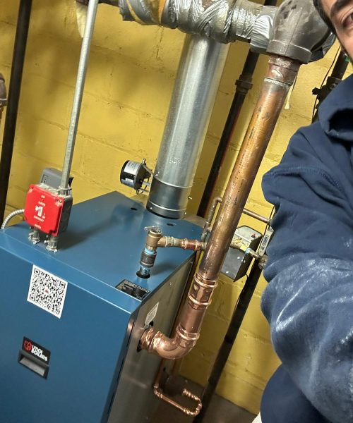 Technician performing boiler installation – Woodland Park