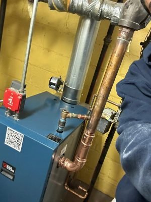 Technician performing boiler installation – Woodland Park