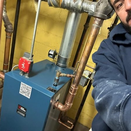 Technician performing boiler installation – Woodland Park